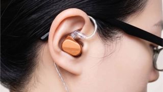 The Saccater Aera in a woman's ear.