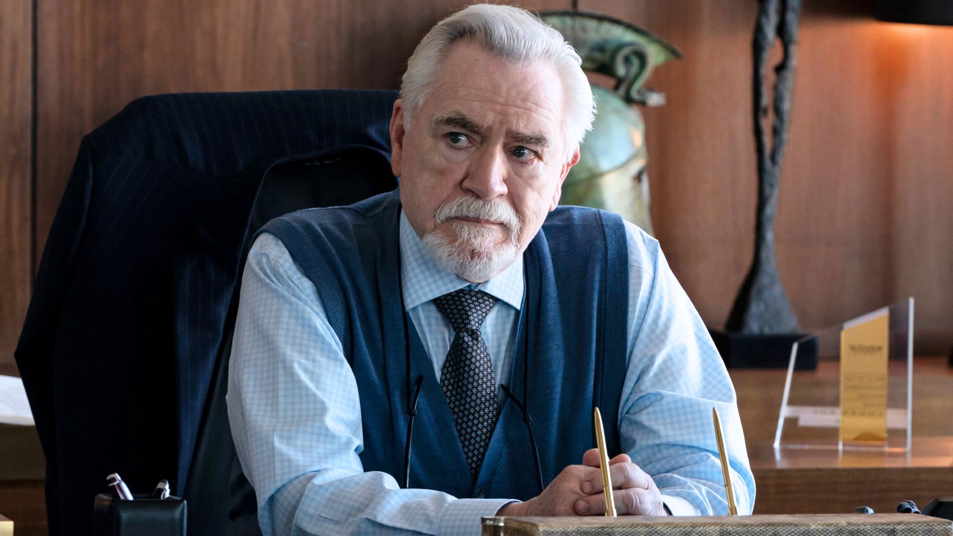 Logan Roy sits at his desk