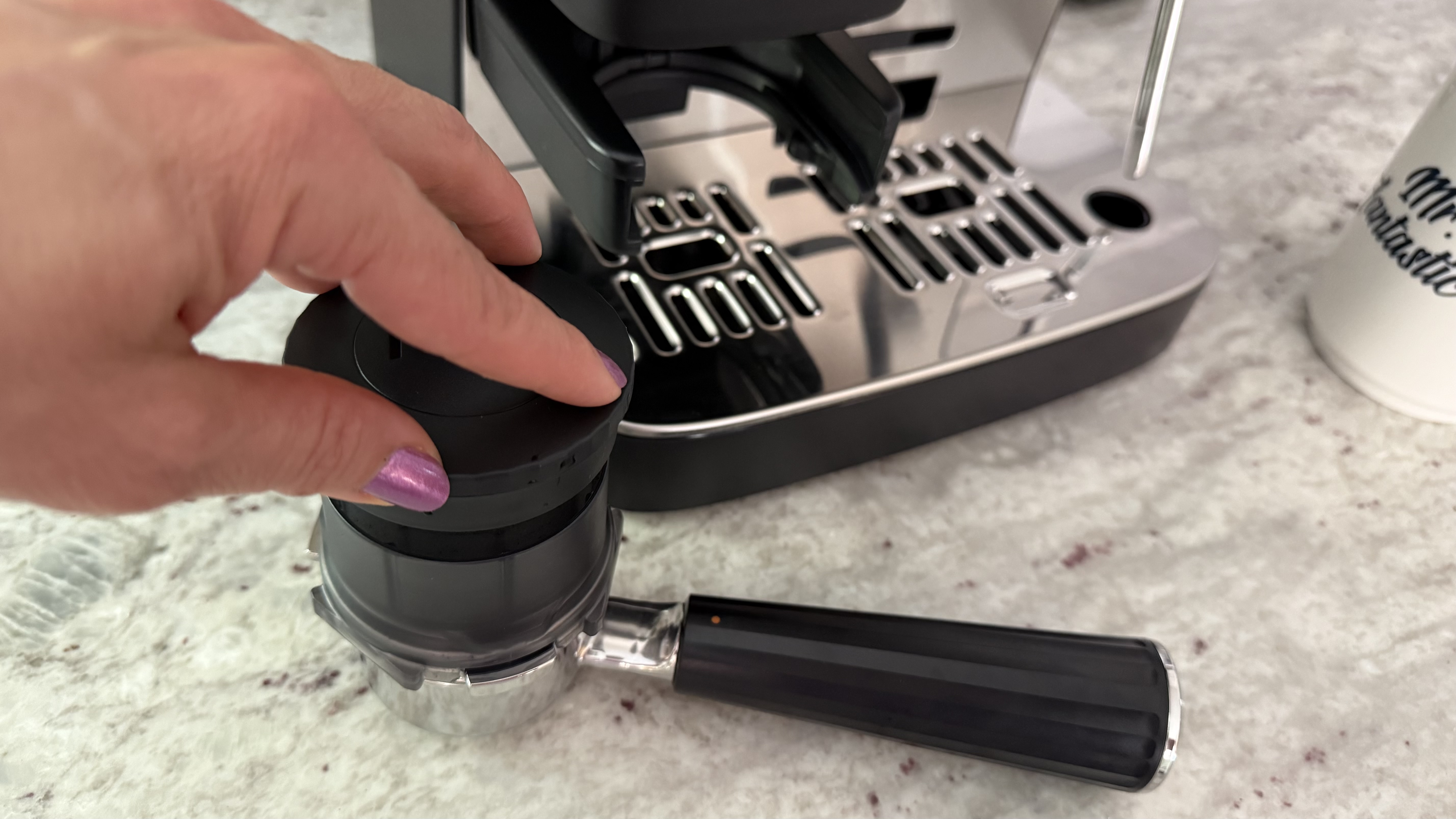 Ninja Luxe Caf&amp;eacute; Mini Espresso Machine tamping down grounds
