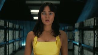 Lucy wearing a yellow dress and looking shocked in Fallout season 2 episode 7