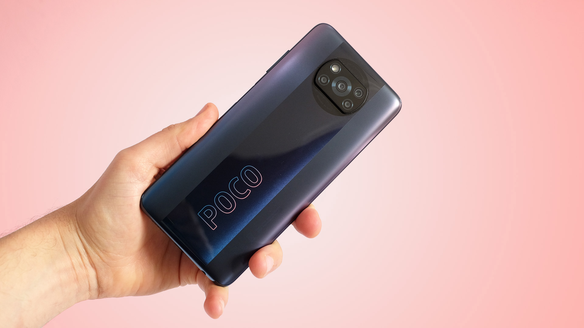 A Xiaomi Poco X3 Pro in someone's hand, from the back