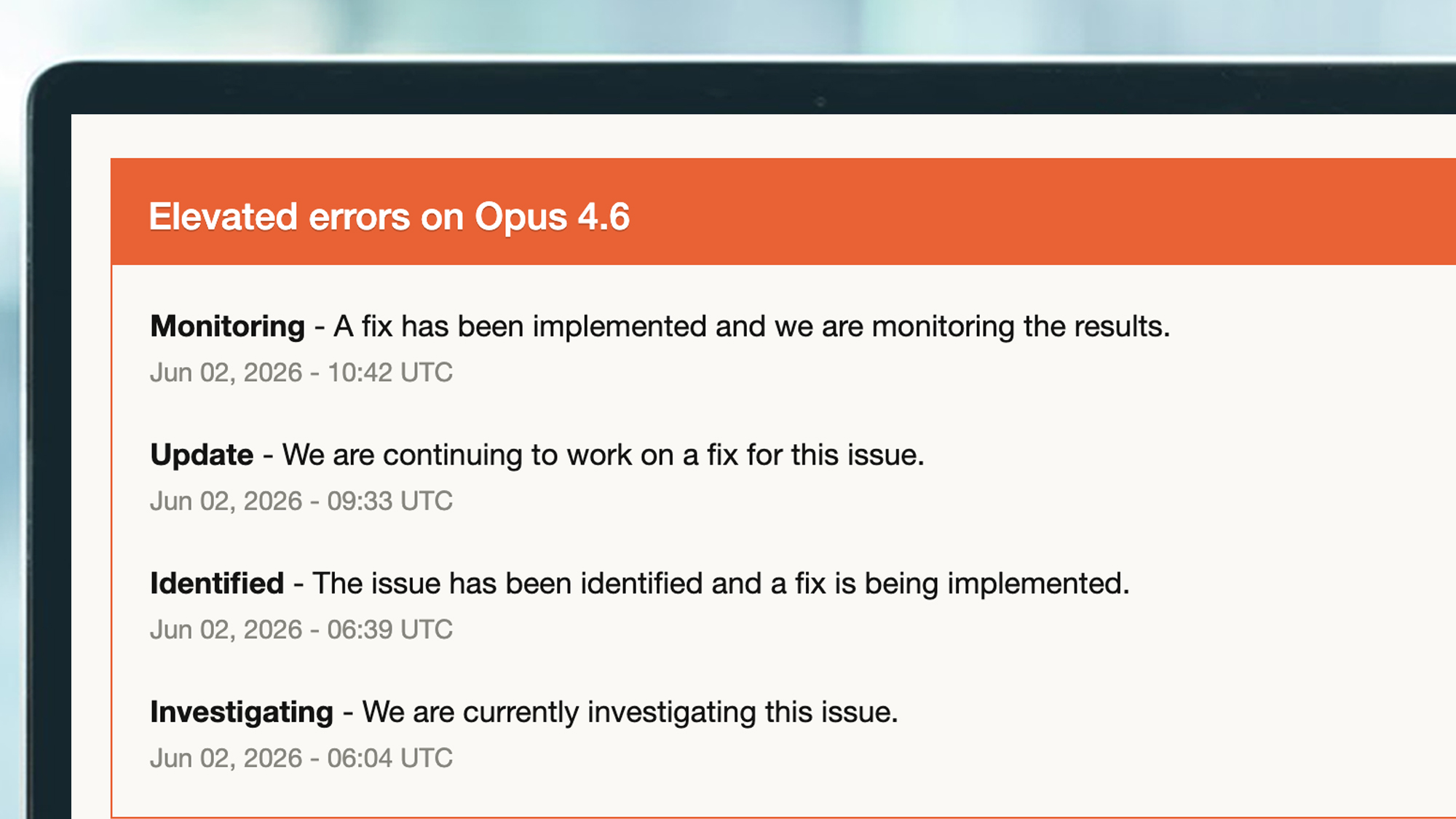 A laptop screen showing 'elevated errors' on Claude's status page