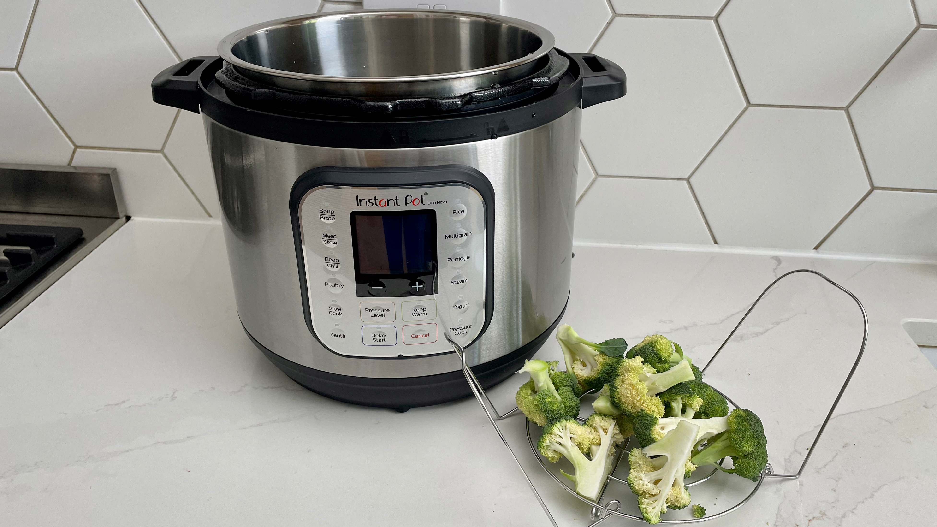 Broccolli which has been steamed in an Instant Pot Duo Nova on a kitchen countertop