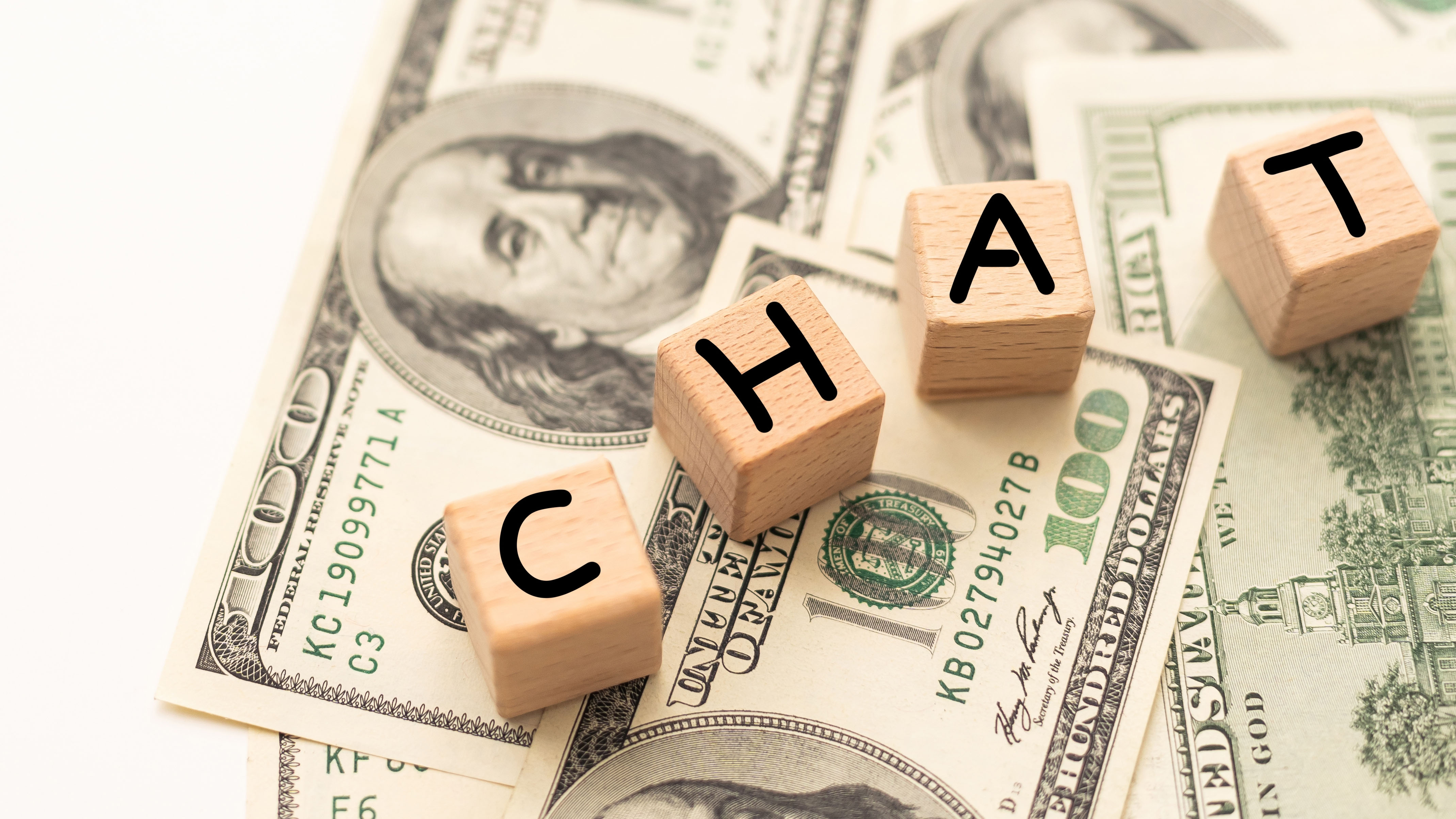 Chat written on wooden blocks and money.