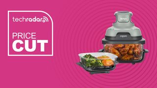 Ninja Crispi Air Fryer in sage with containers on pink background with TechRadar price cut sign