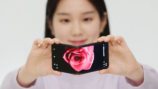 Woman showing Samsung display Flex In&Out