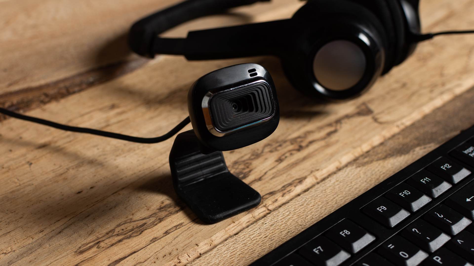 Close up of a webcam on a wooden desk