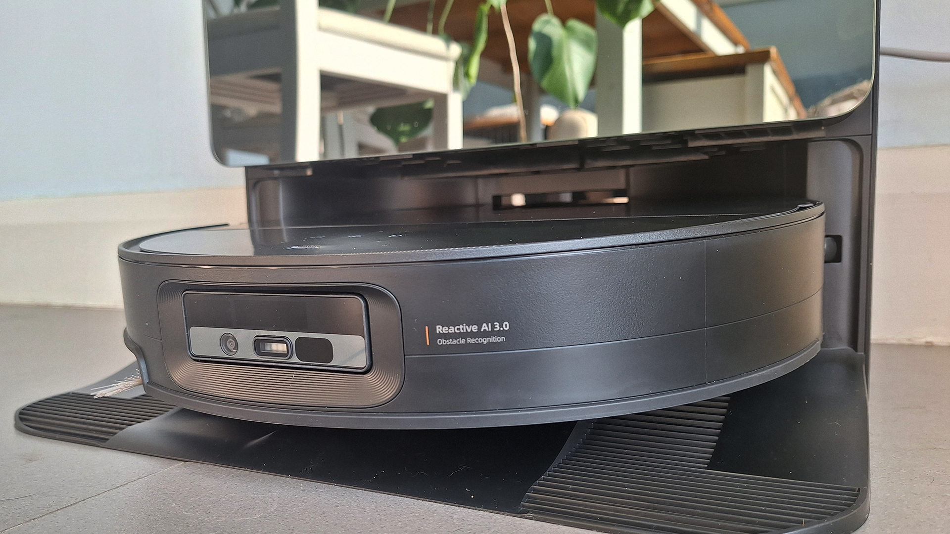 Roborock Saros 10 robot vacuum in its dock, in reviewer's home