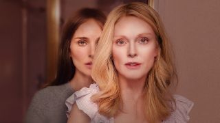 Natalie Portman standing behind Julianne Moore in a promotional image from Oscar-nominated movie May December