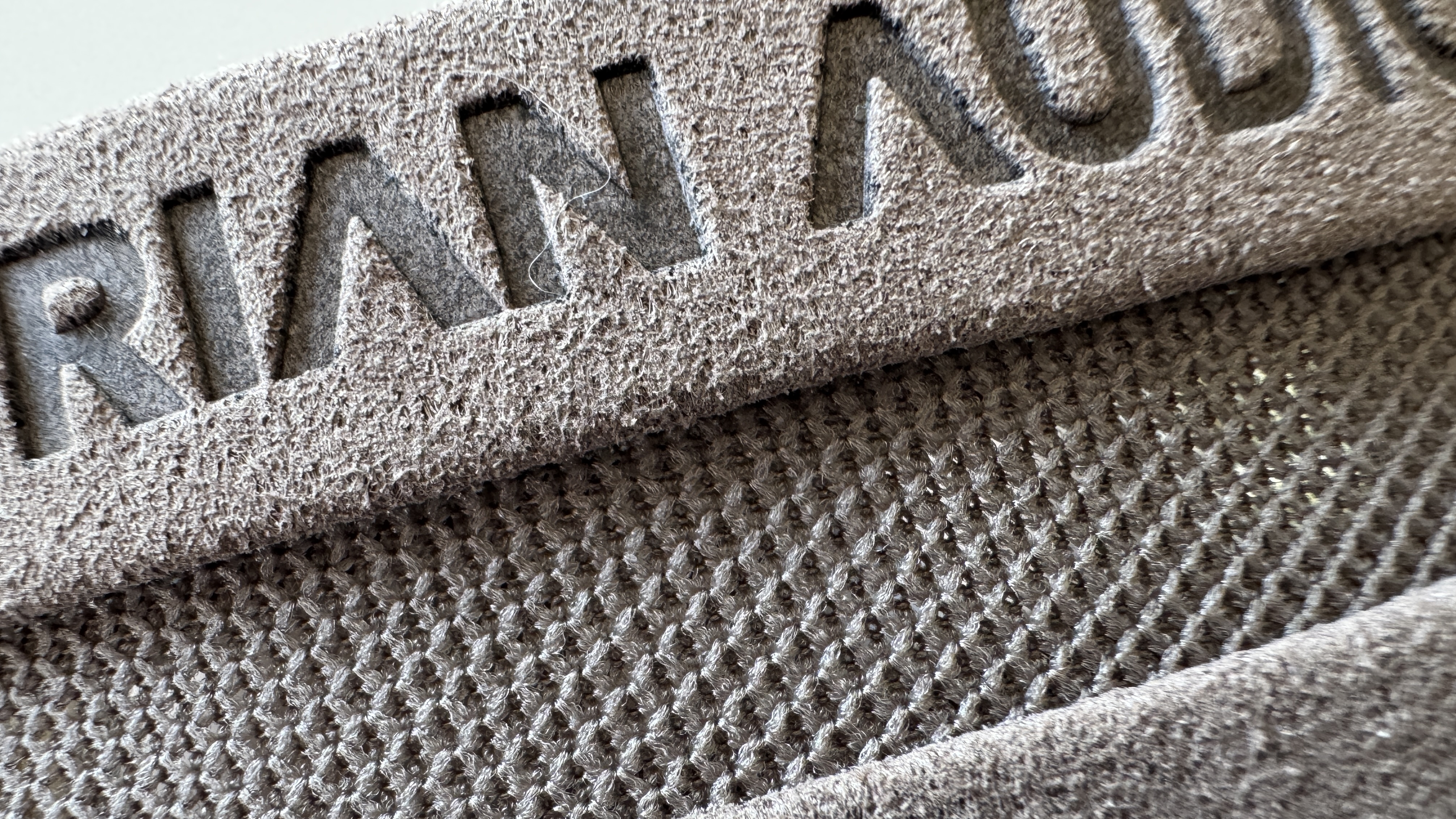 Close-up of the headband for the Austrian Audio The Arranger over-ear headphones, on a white surface.