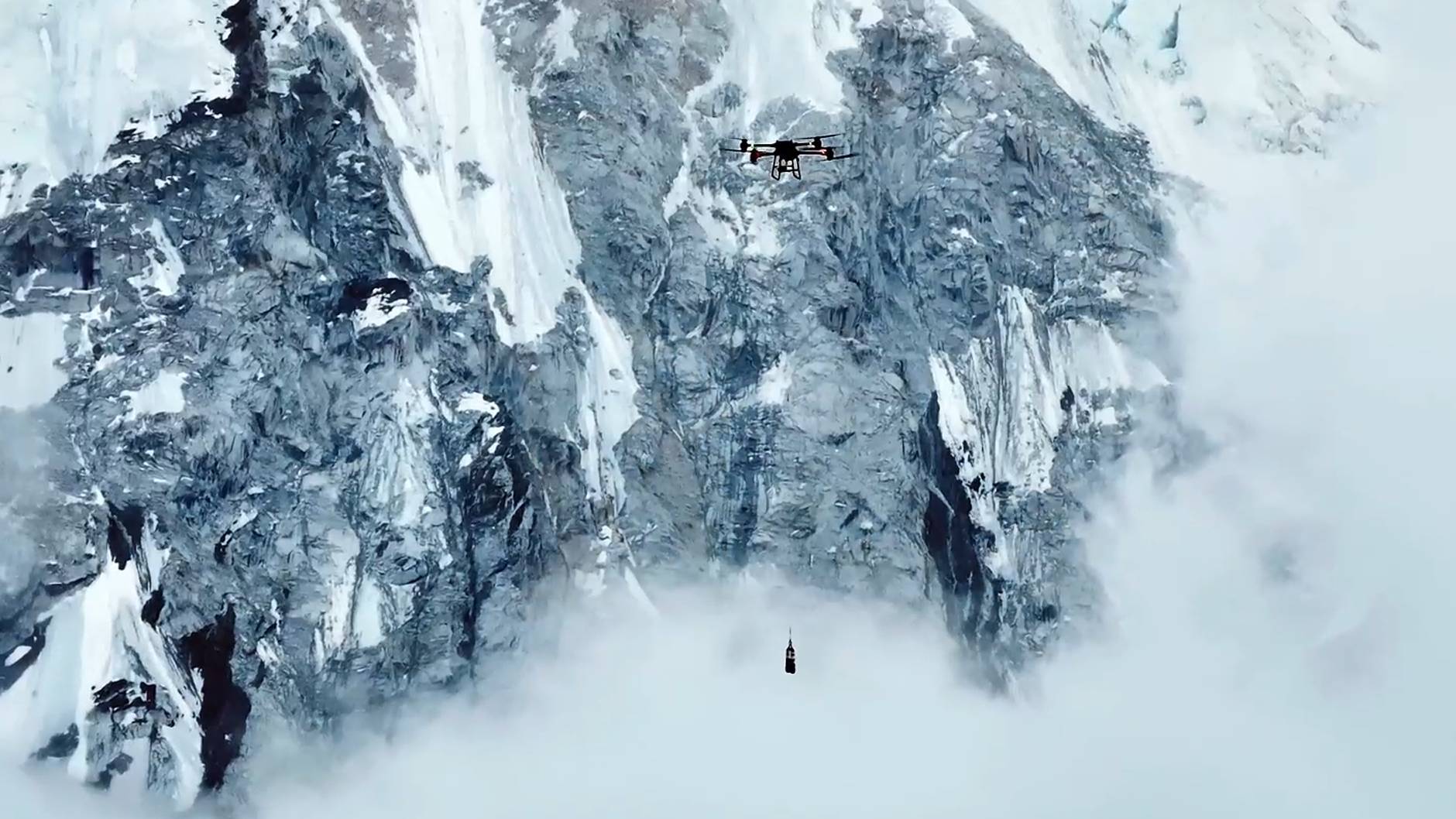 A DJI FlyCart 100 drone transports material over Mount Everest