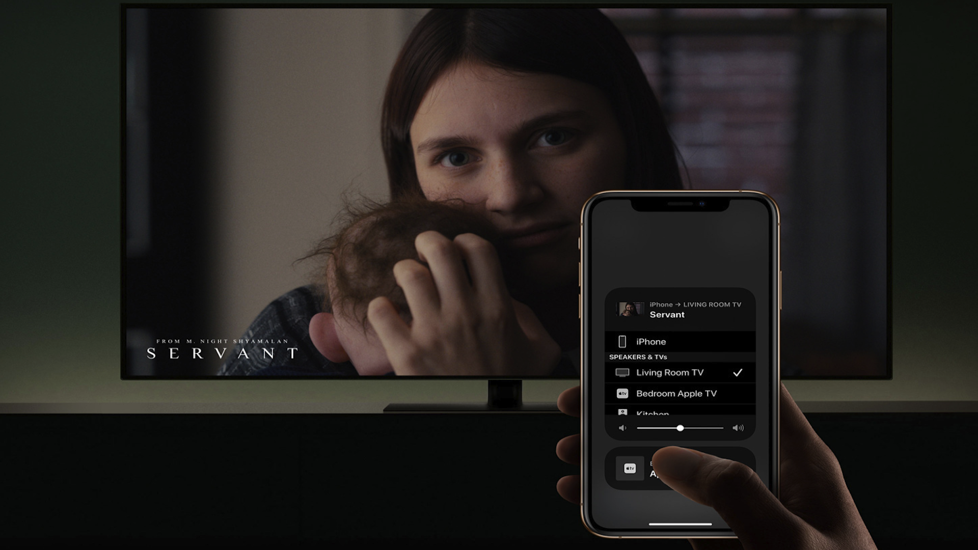 TV screen in background with phone in foreground