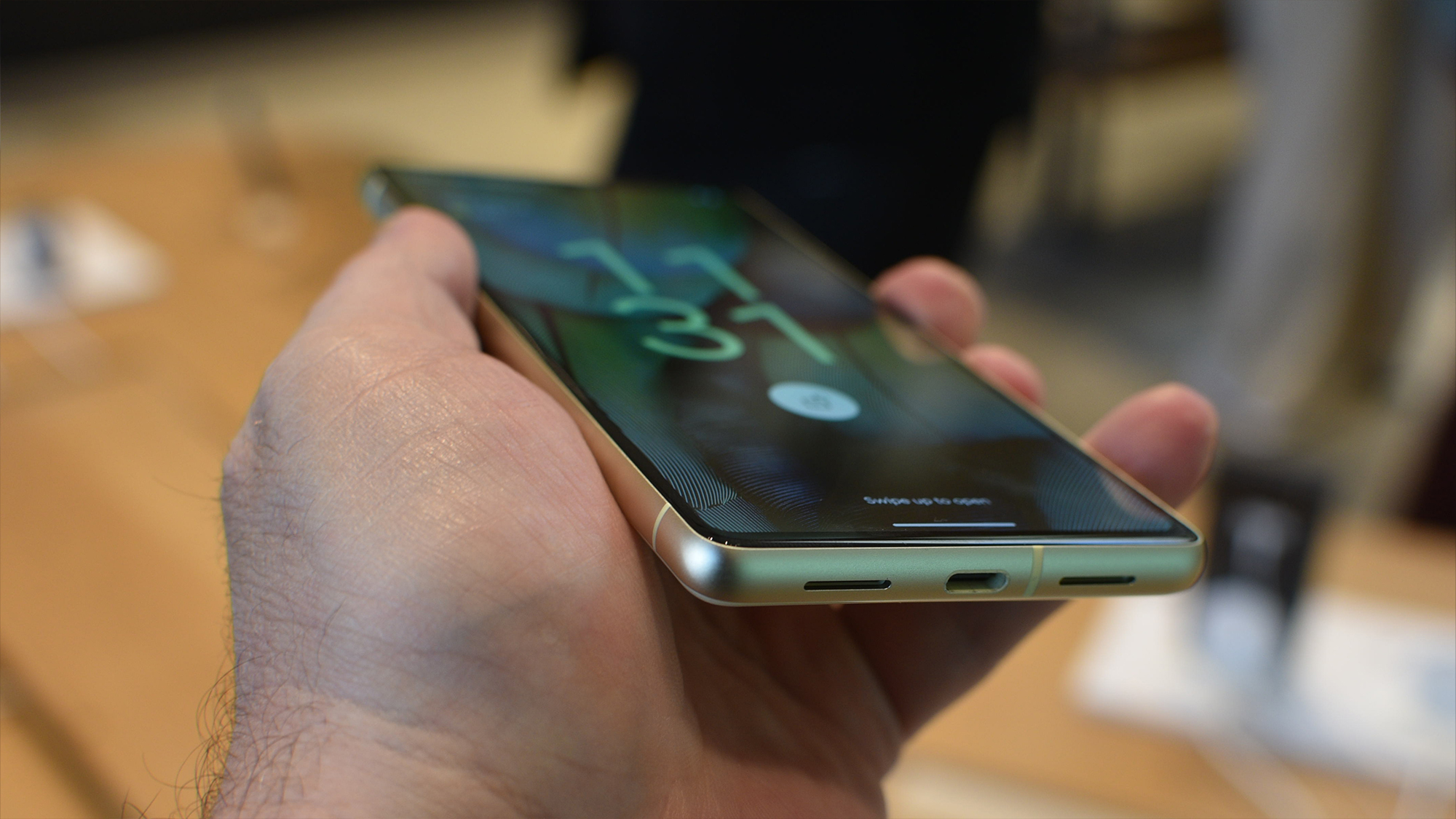 Google Pixel 7 hands on angled ports Lemongrass