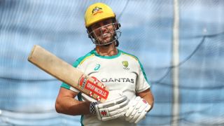 Mitchell Marsh holding bat at training session