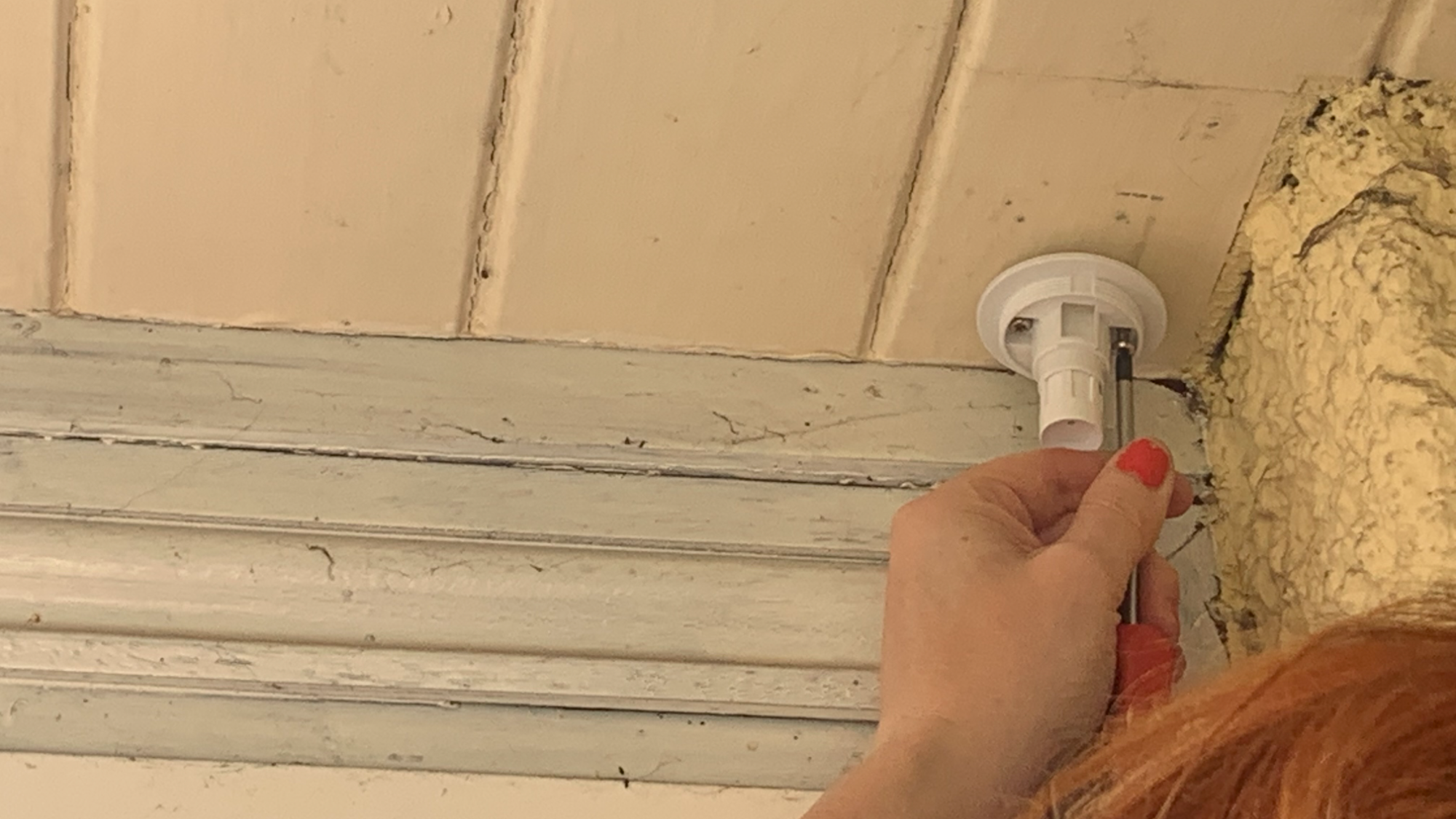 Swann 650 porch camera mount being screwed in place