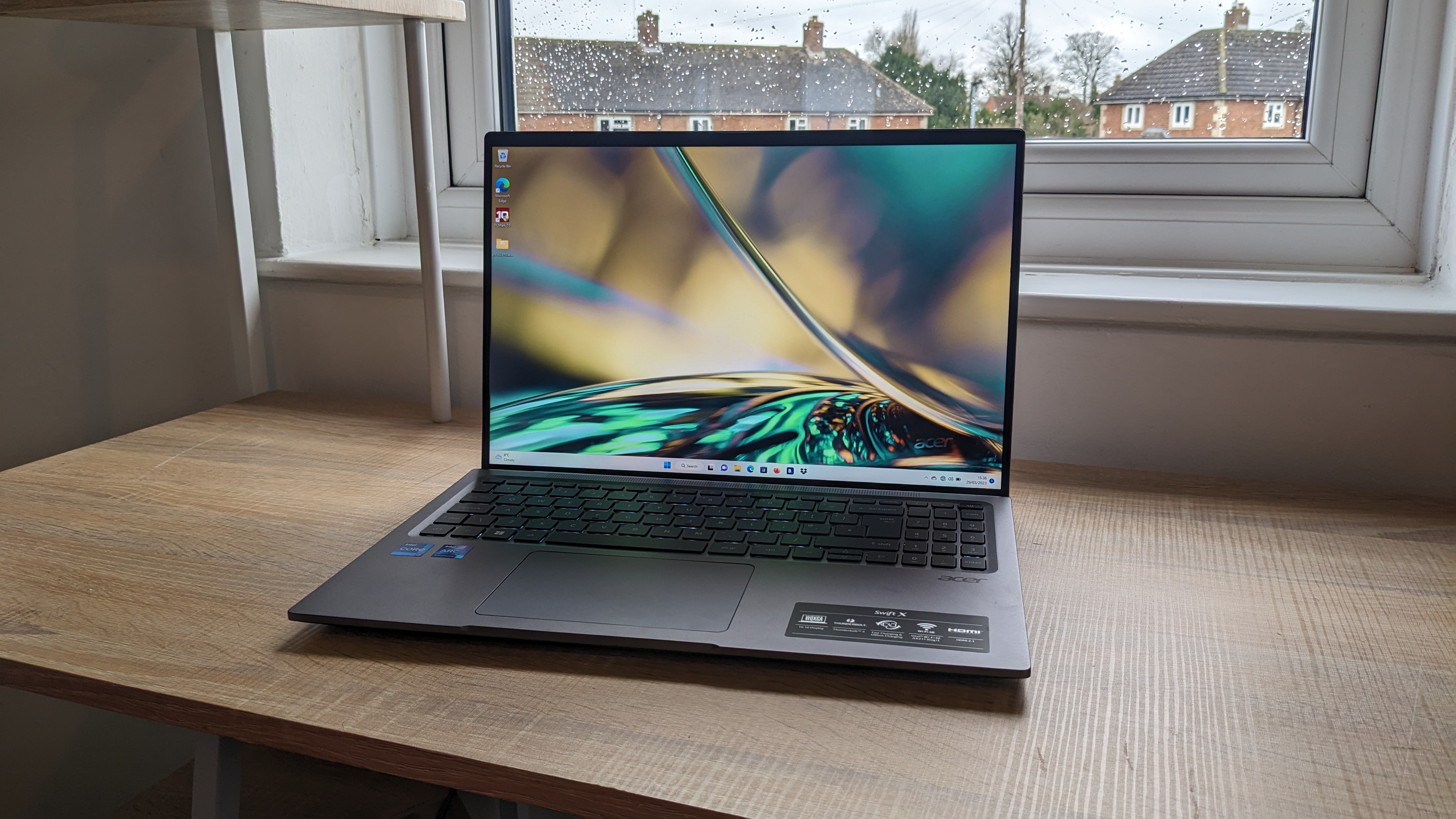 Acer Swift X 16 on wooden table