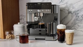 Ninja Luxe Caf&eacute; coffee machine with drinks on kitchen counter
