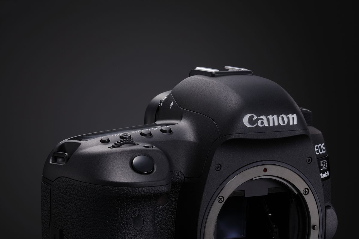Canon EOS 5D Mark IV DSLR camera on black background