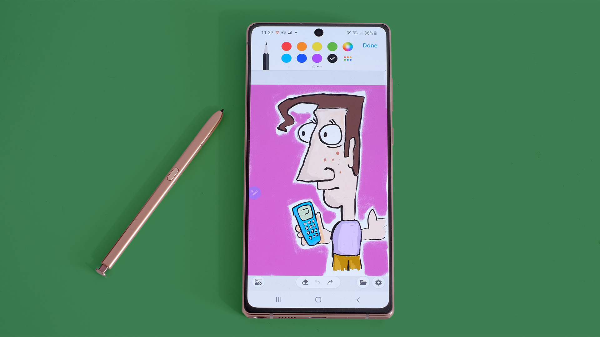 A Samsung Galaxy Note 20 on a green background
