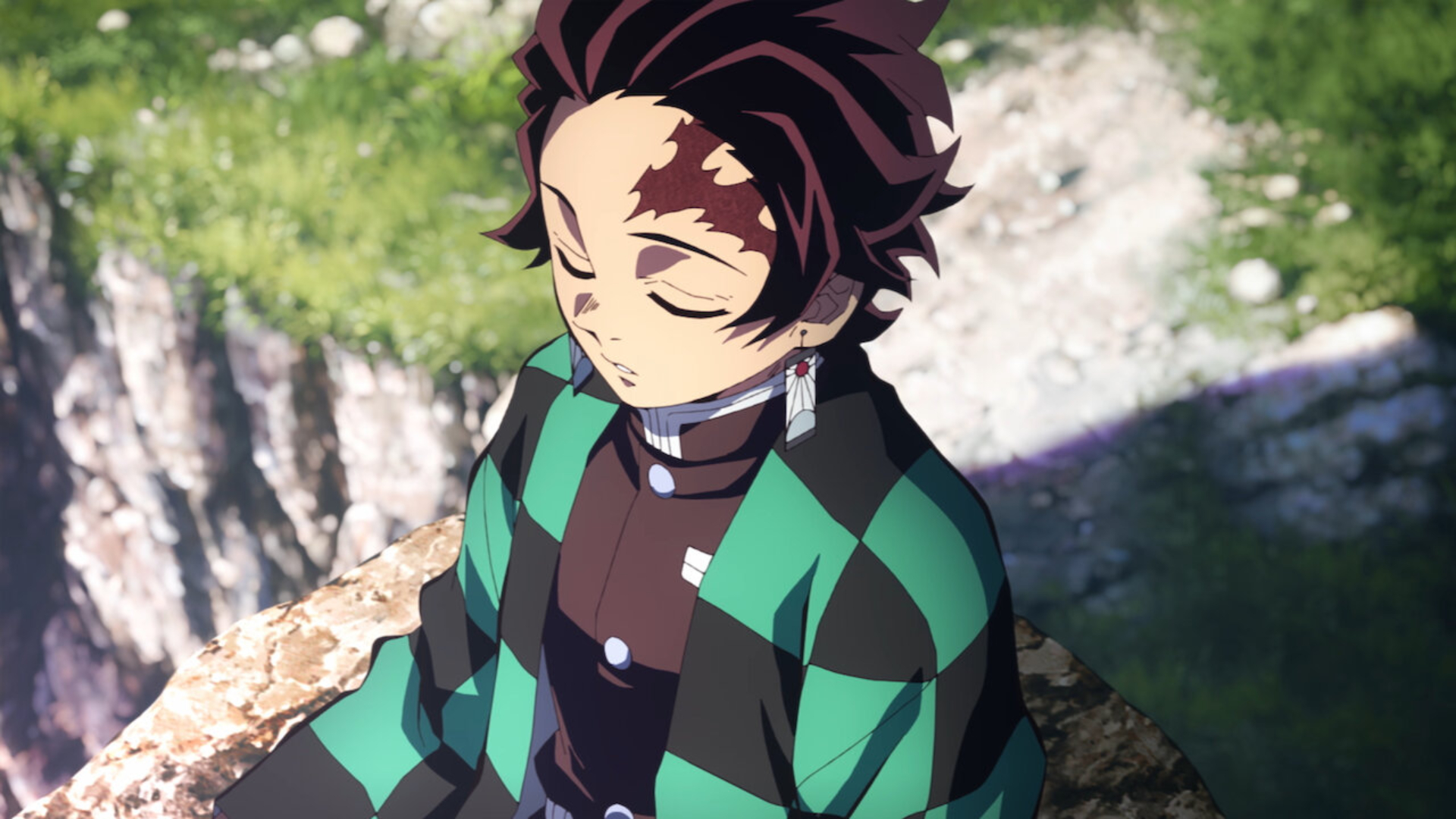 Tanjiro rests atop a rock in Demon Slayer season 4