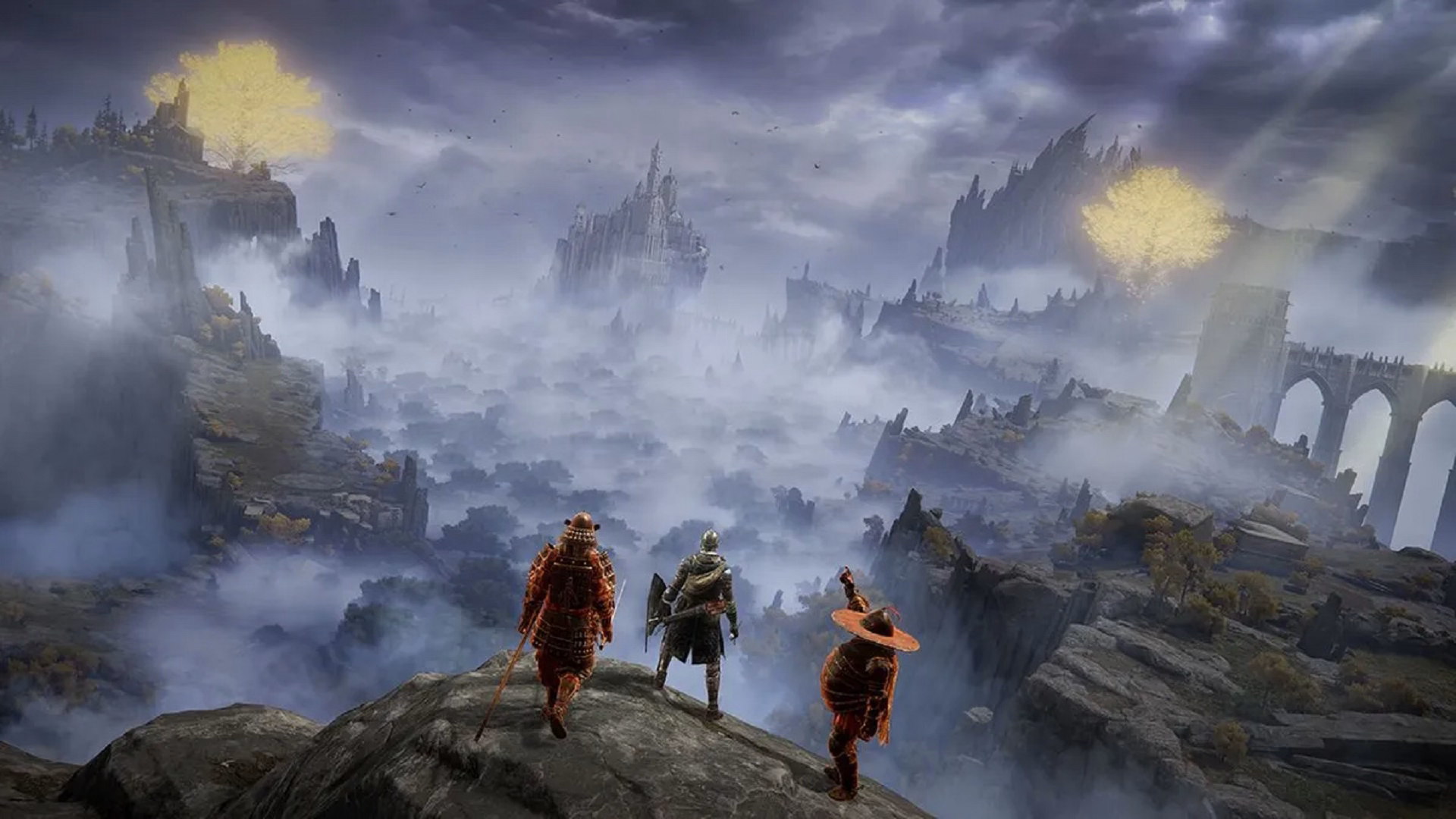 Three Elden Ring players stand on a ledge overlooking The Lands Between