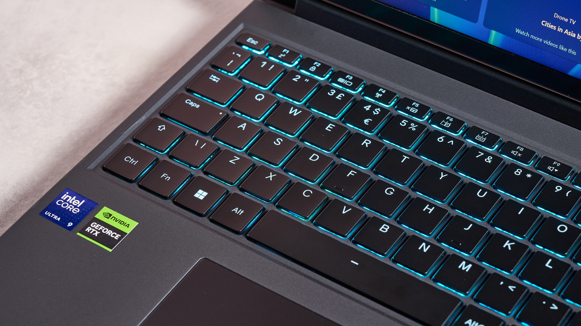 Close-up of left side of keyboard on Medion Erazer Major 16 X1 with RGB lighting on