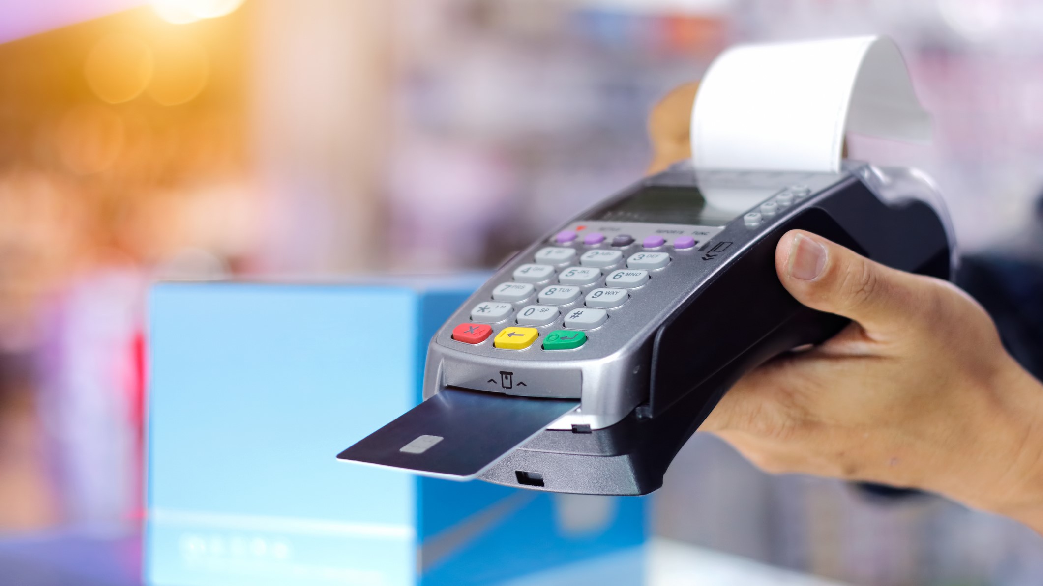 Person pays using POS hardware card reader