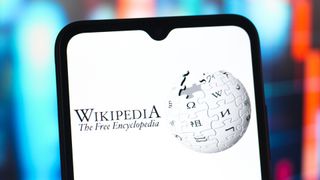 In this photo illustration, the Wikipedia logo is seen displayed on a smartphone screen. 