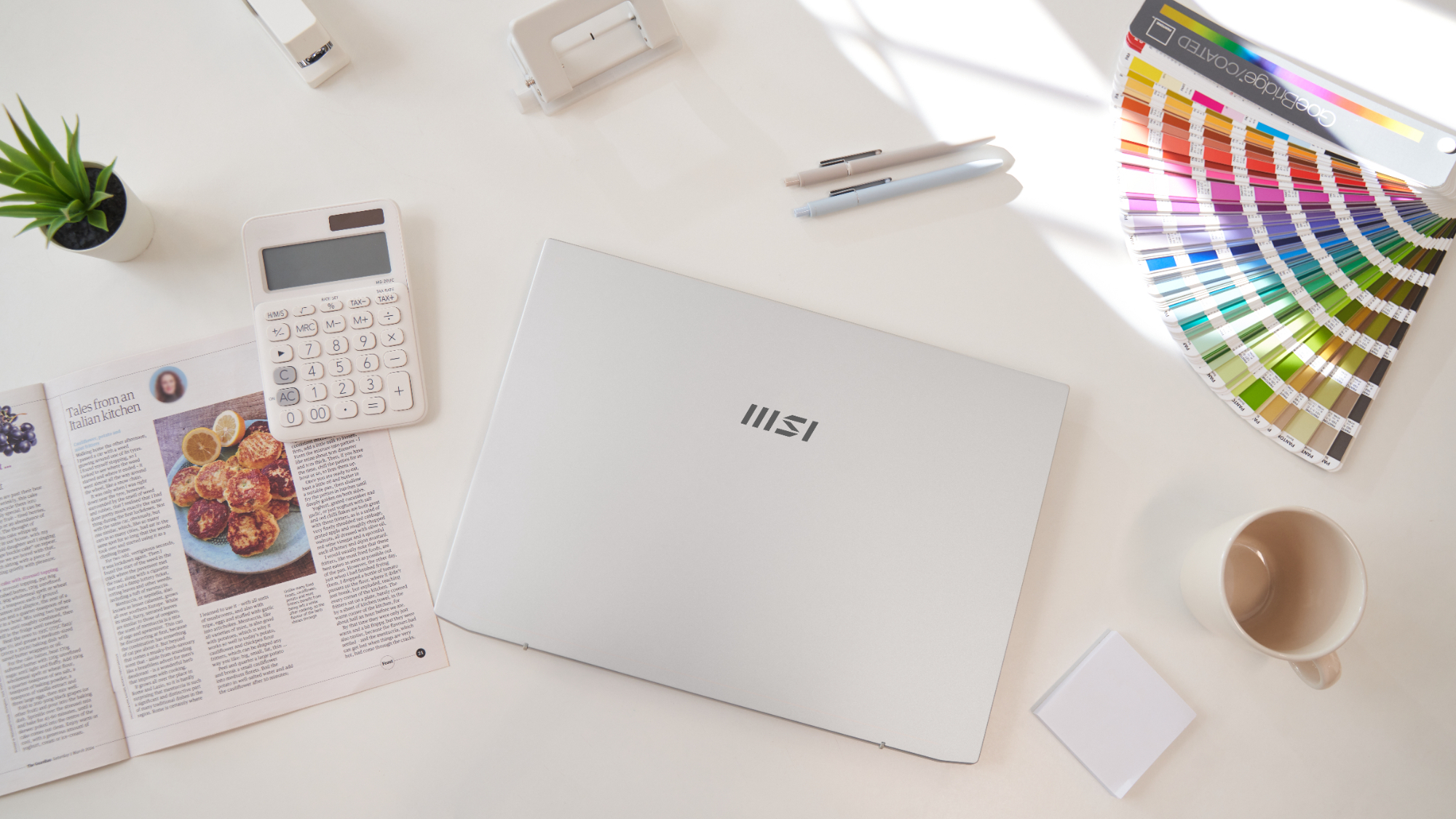 MSI promotional photo of a woman using a Prestige A16 AI+ laptop