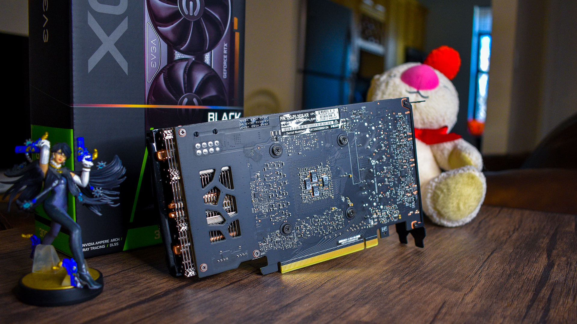 The Nvidia GeForce RTX 3060 sitting on a coffee table with its backplate visible