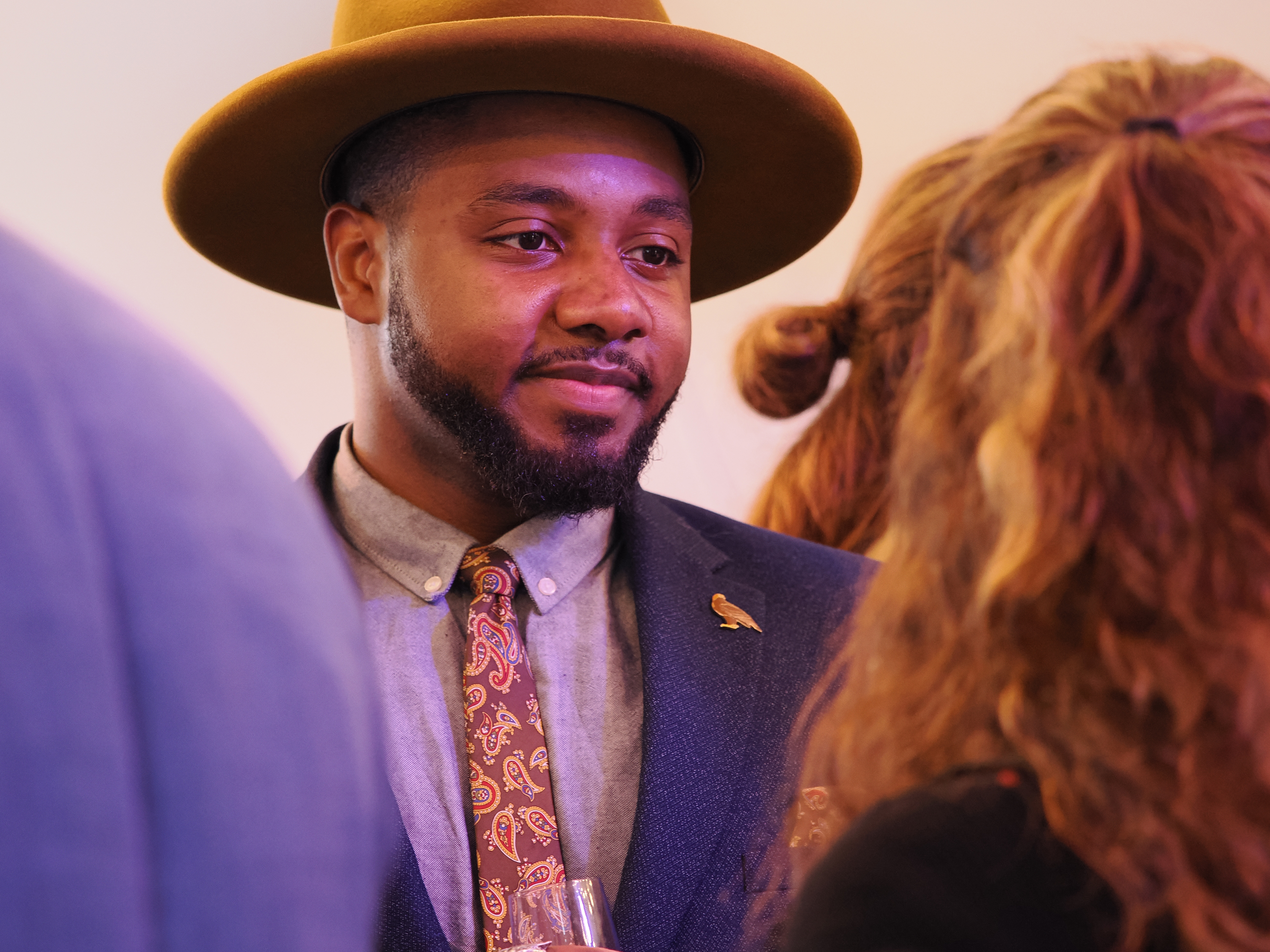 A man in a hat at a party