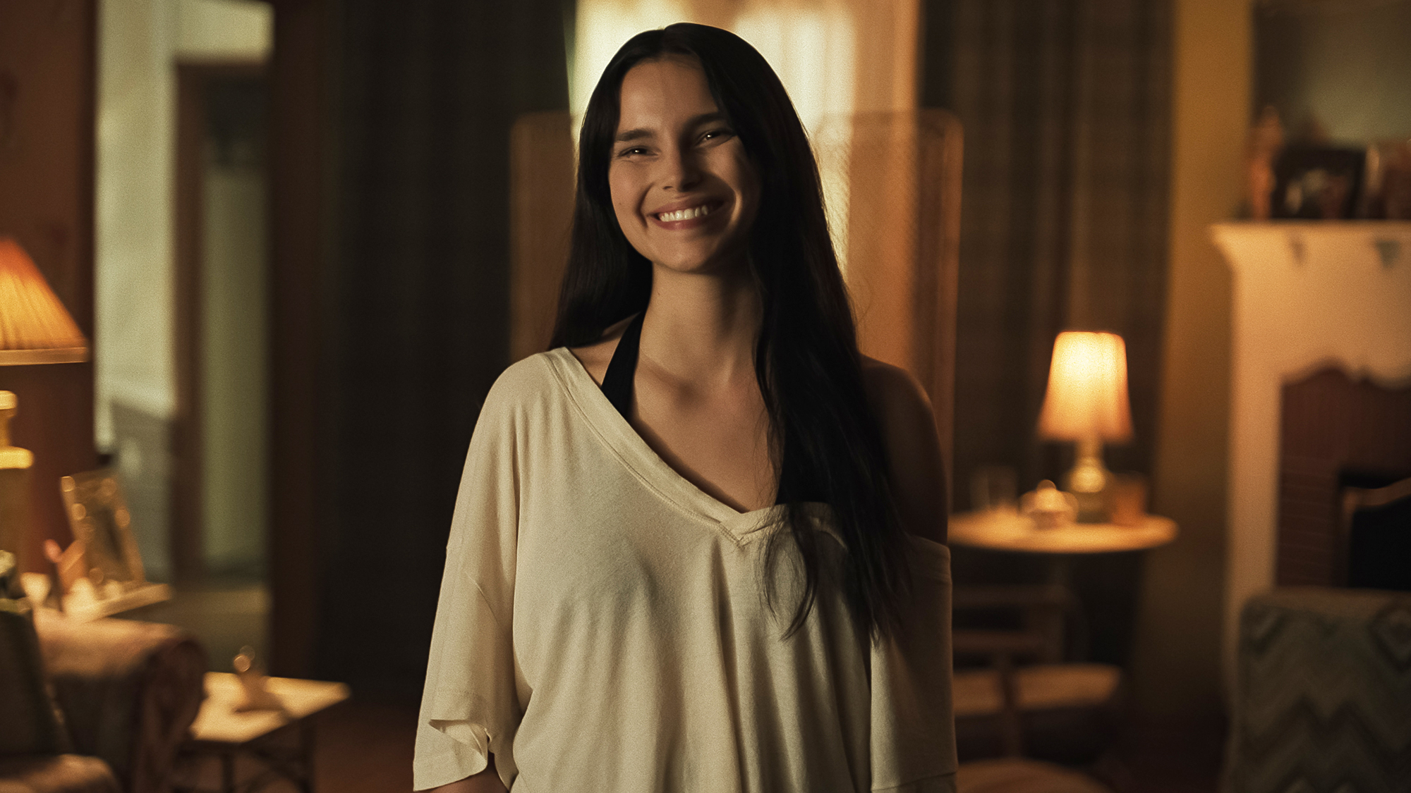 Inde Navarrette's Nikki wearing an uncomfortable smile in Obsession