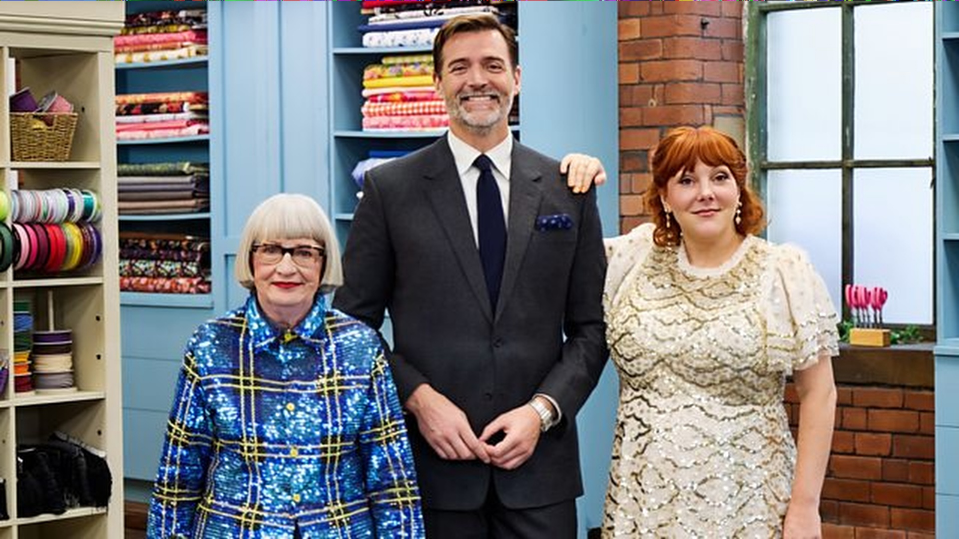 Judges Esme Young and Patrick Grant alongside new host Sophie Willan in a promotional image for The Great British Sewing Bee season 12