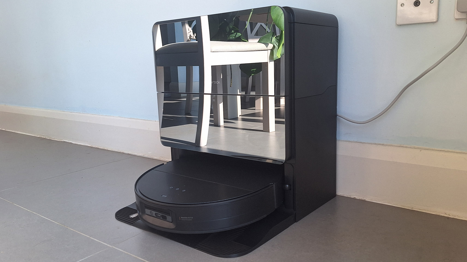 Roborock Saros 10 robot vacuum in its dock, in reviewer's home