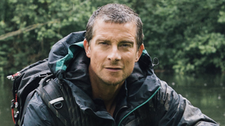 Bear Grylls - Wild Reckoning 2026 TV show watch free on BBC iPlayer right now as the survival expert crouched by a river in an jacket