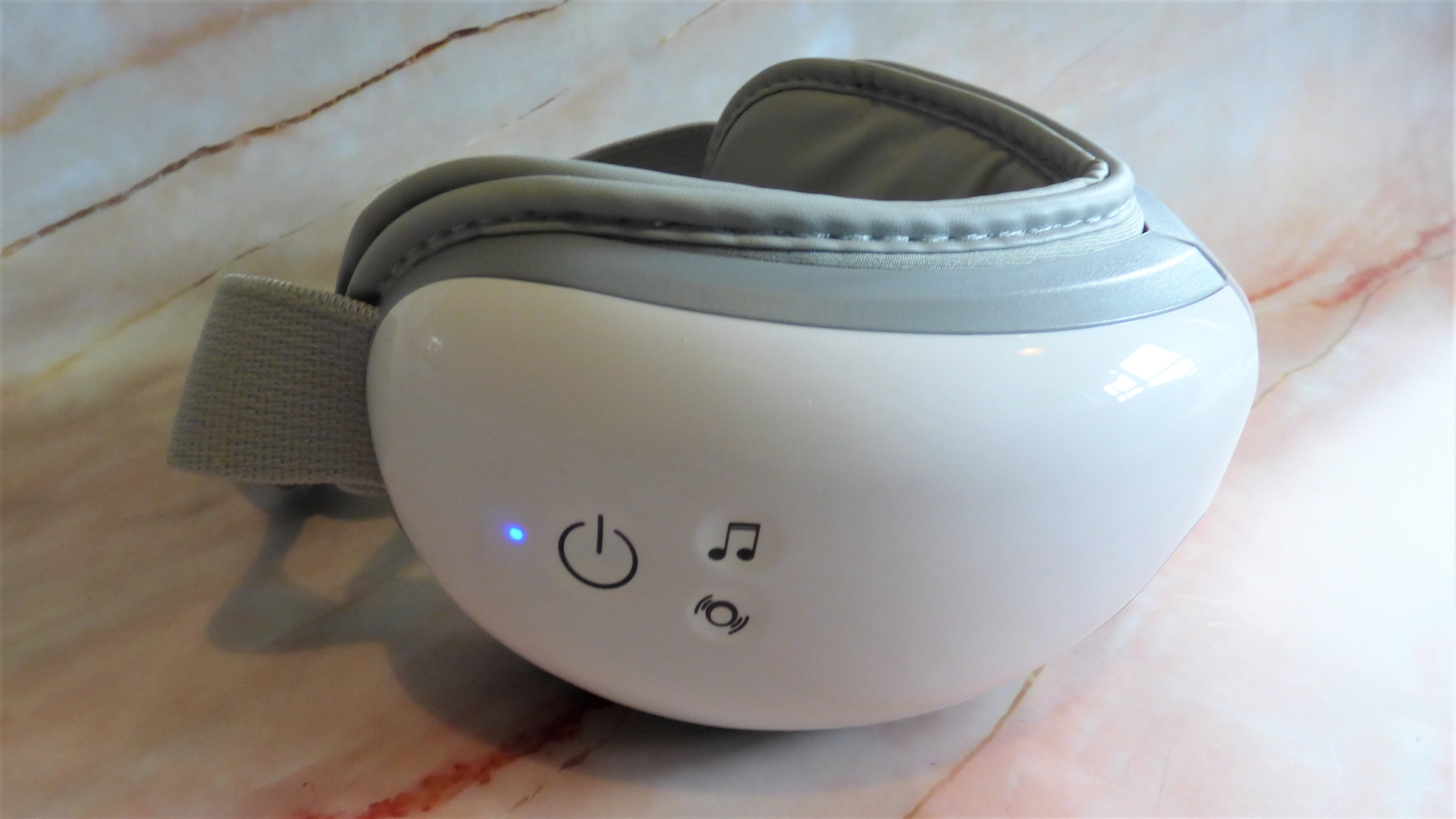 Side of Renpho Eye Massager, showing control buttons