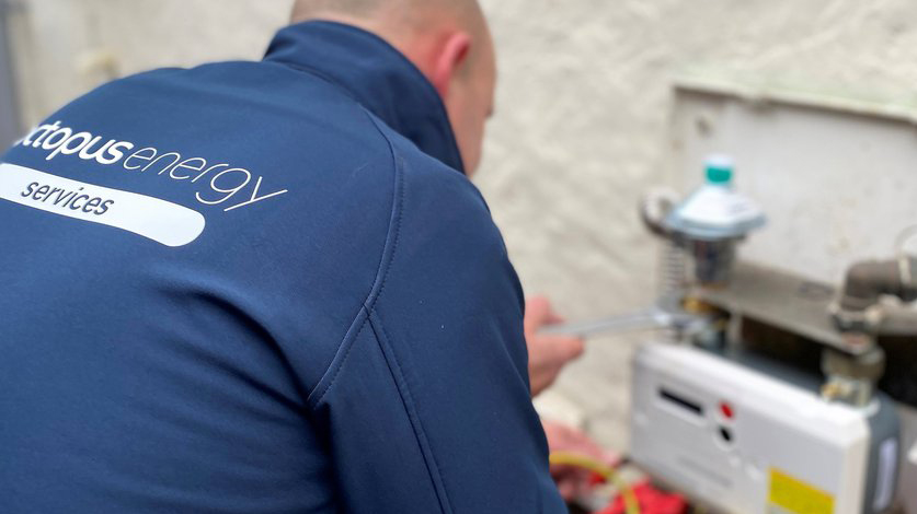Octopus Energy review: engineer installing a smart meter