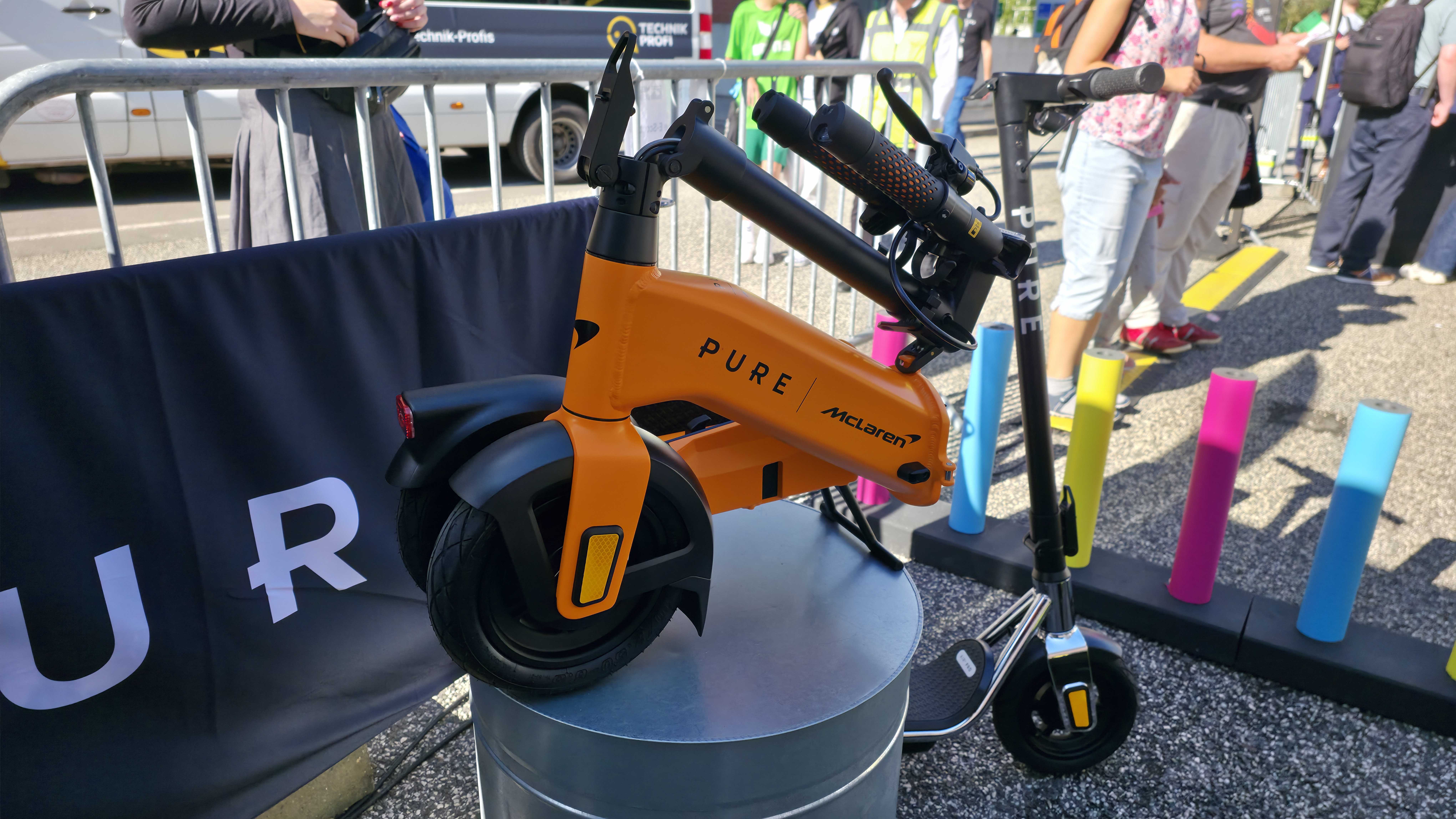 Pure Electric scooters at IFA 2025, it's a sunny day and the stand is forward facing.
