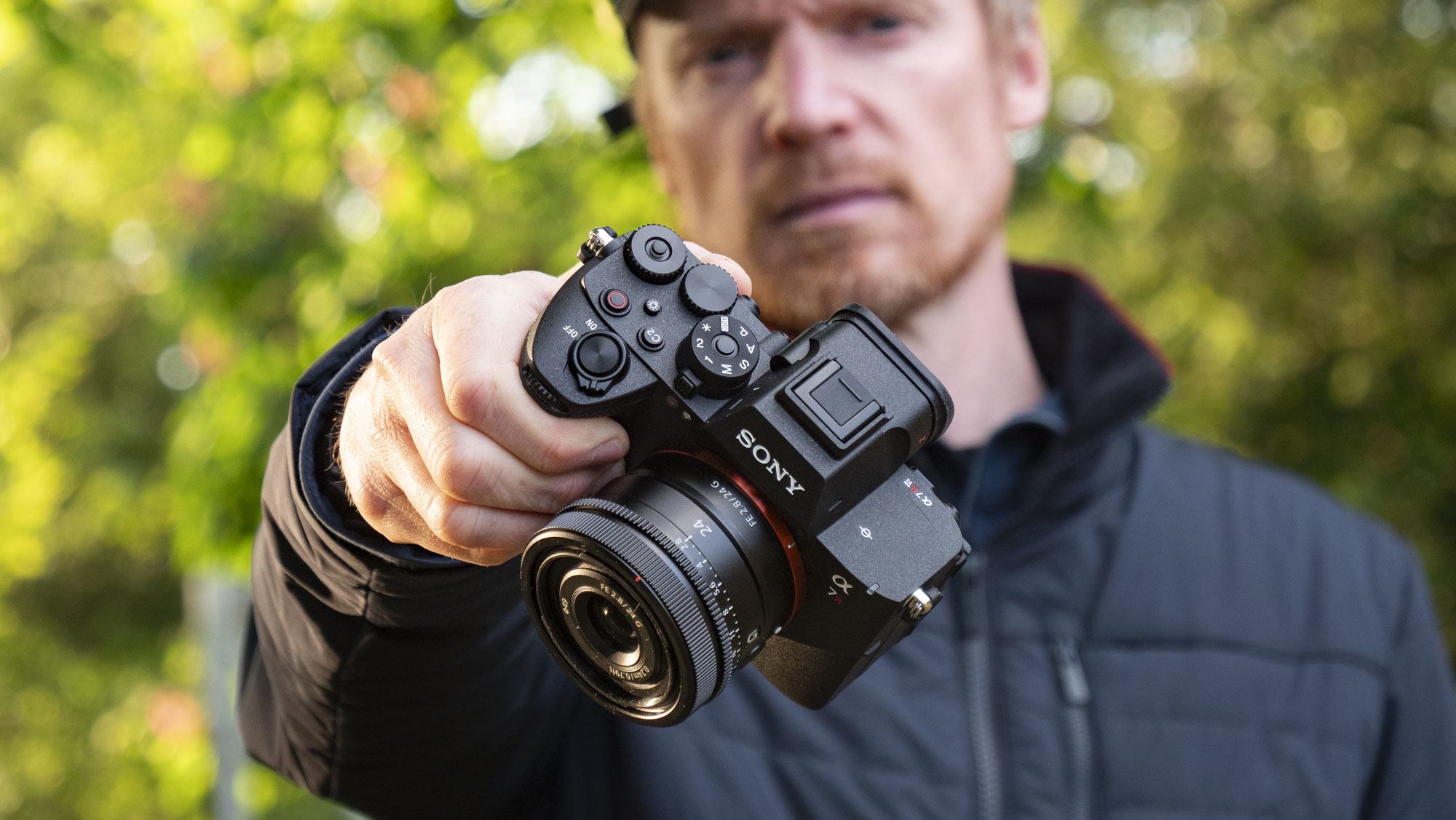 Sony A7R VI camera with 24mm F2.8 lens attached, in user's hands
