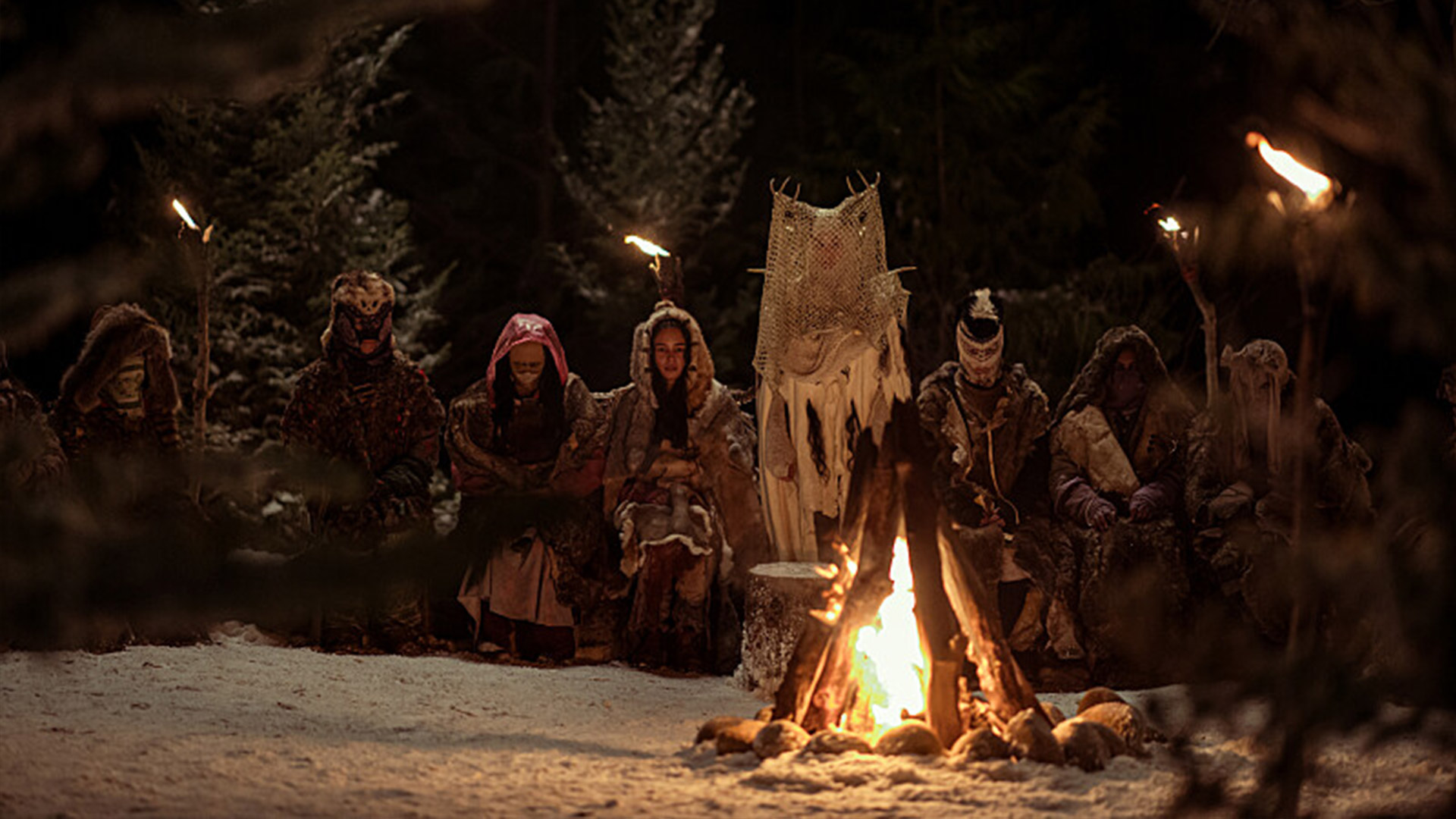 The girls gather round the fire in Yellowjackets season 3