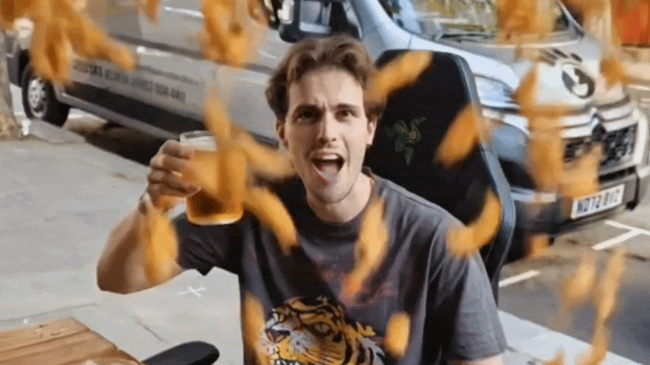 An AI generated video with phones editor Axel Metz being showered with tempura prawns.