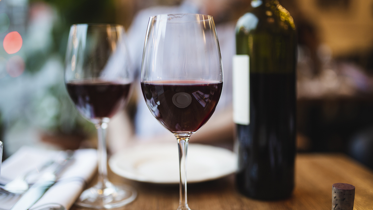 Two wine glasses filled with red wine