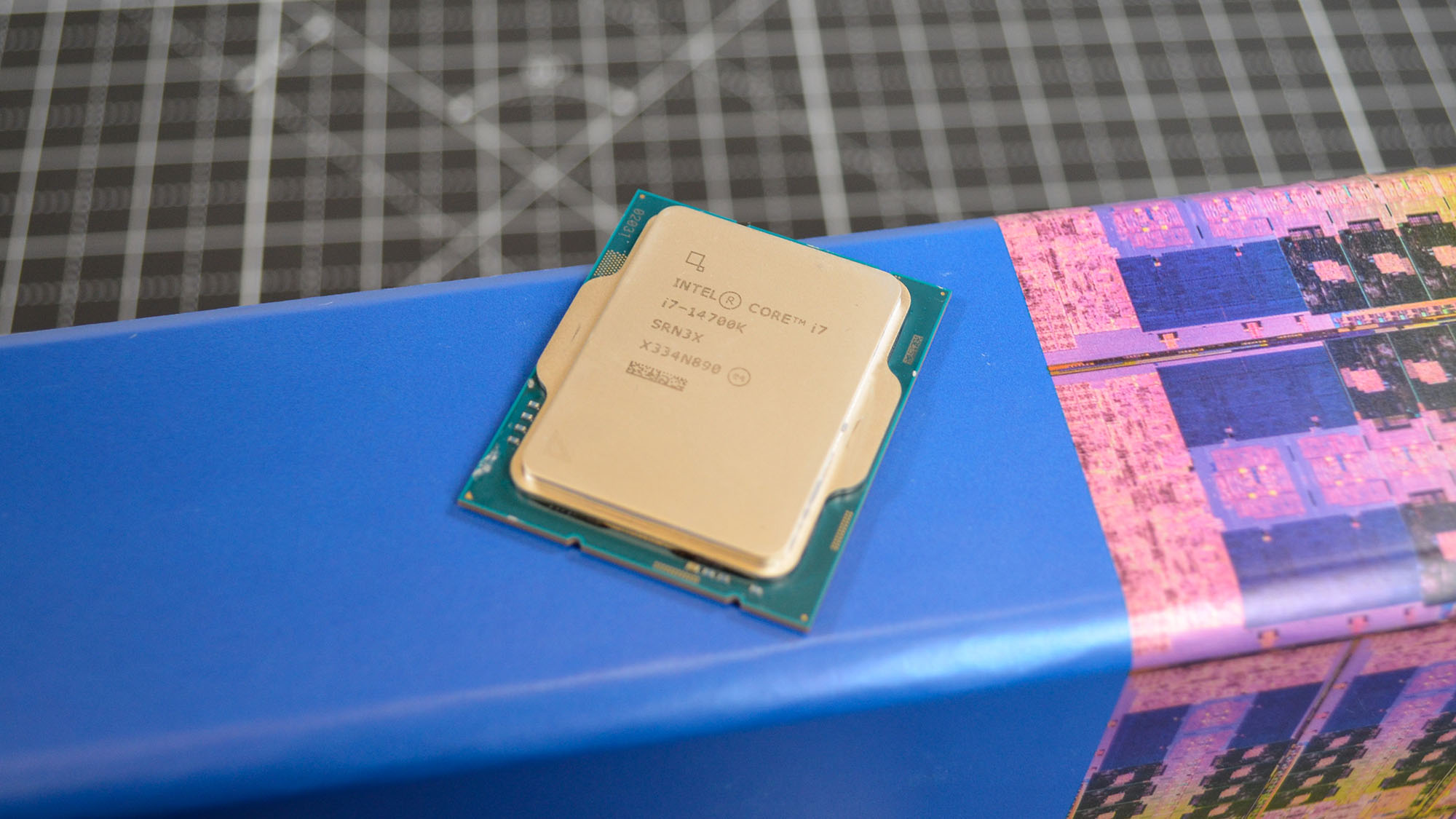 An Intel Core i7-14700K with its promotional packaging