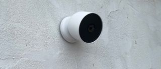 The Google Nest Cam (battery) mounted to a wall outside