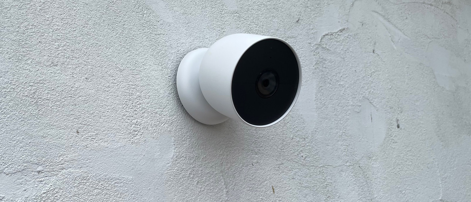 The Google Nest Cam (battery) mounted to a wall outside