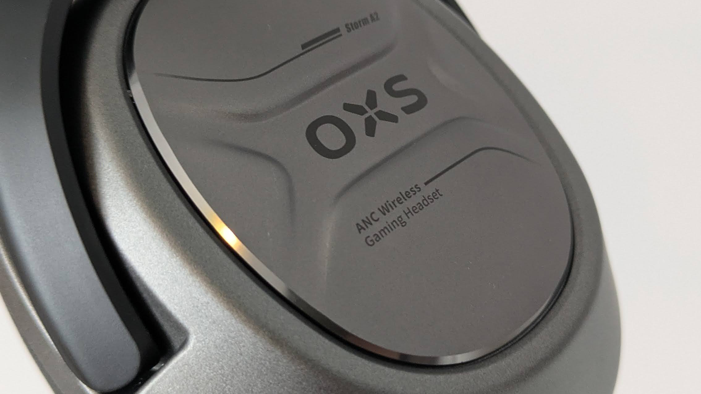 Close-up of driver on OXS Storm A2, with logo and text visible