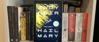 The Amazon Fire HD 10 (2021) on a bookshelf