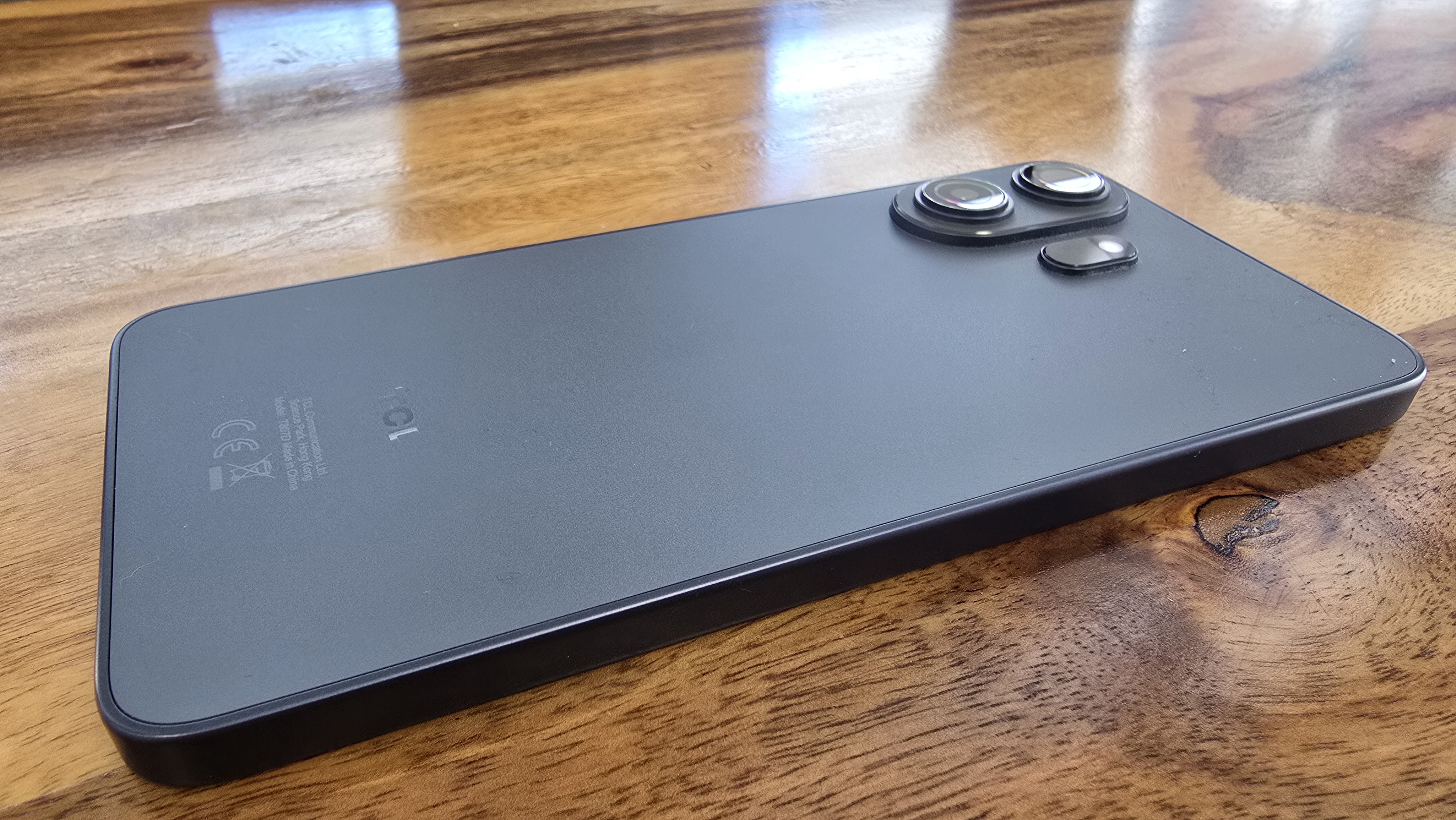 TCL NXTPAPER 70 Pro smartphone in an office and outdoors