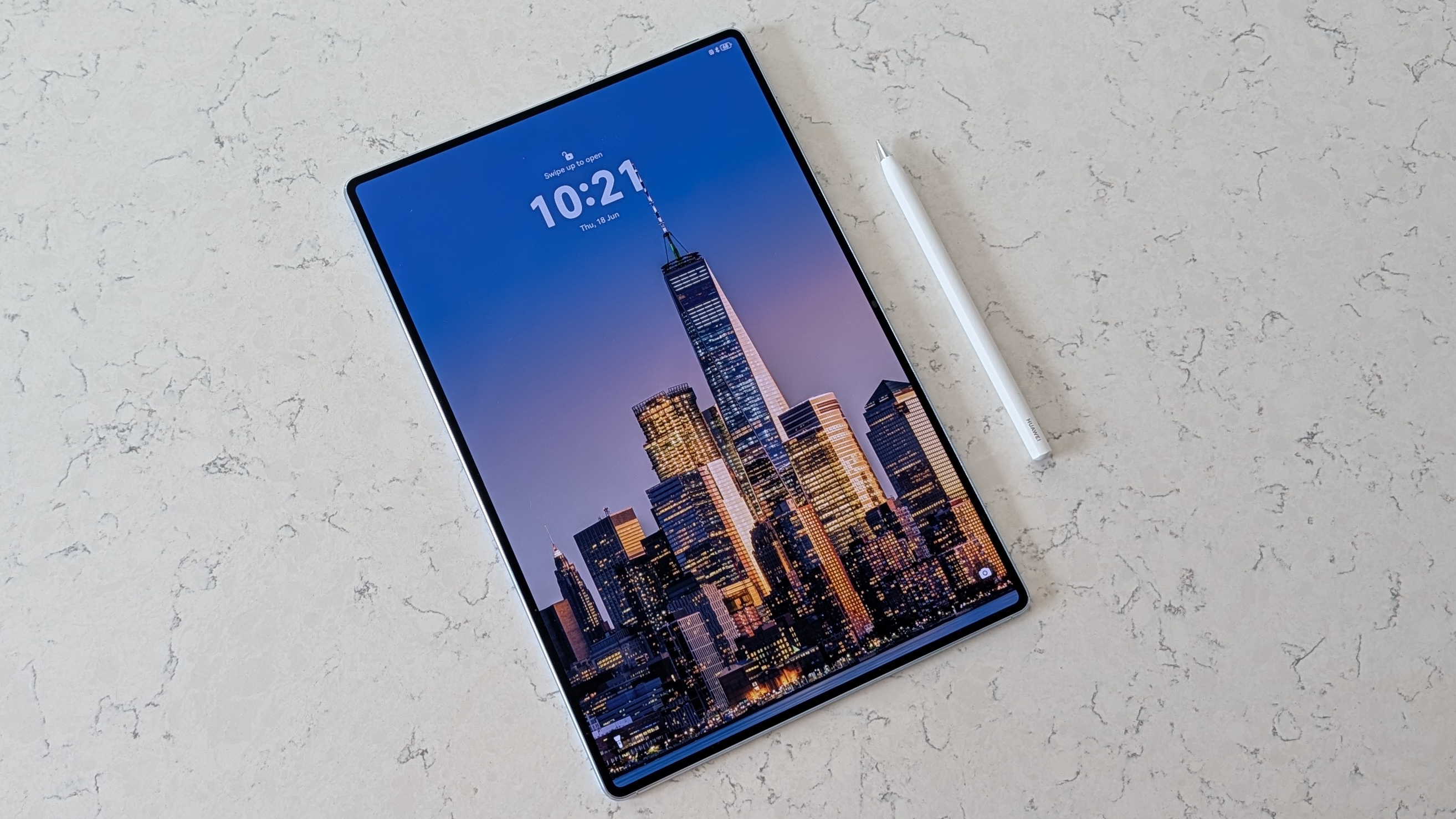 Photos of the Huawei MatePad Pro Max resting on a marble table