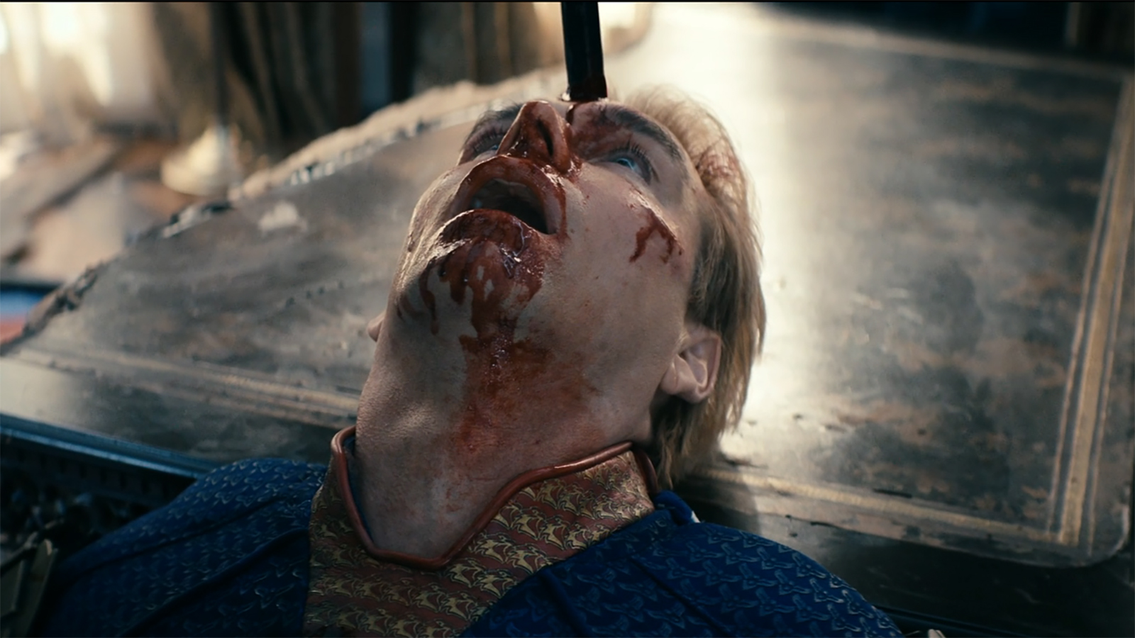 A dead Homelander with a crowbar sticking out of his head in The Boys season 5 episode 8